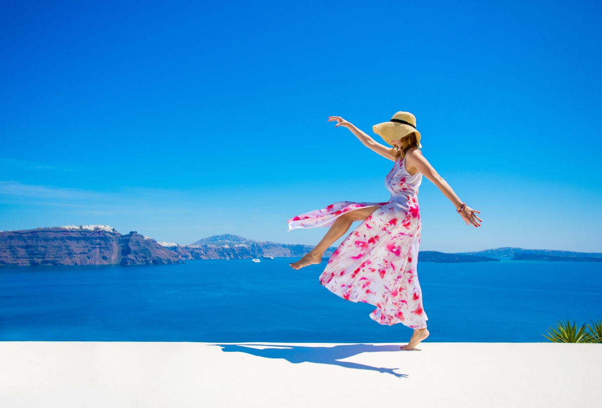 Woman dancing near water