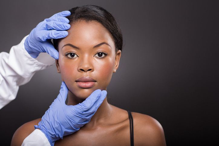 dermatologist-examing-face-off-African-American-woman