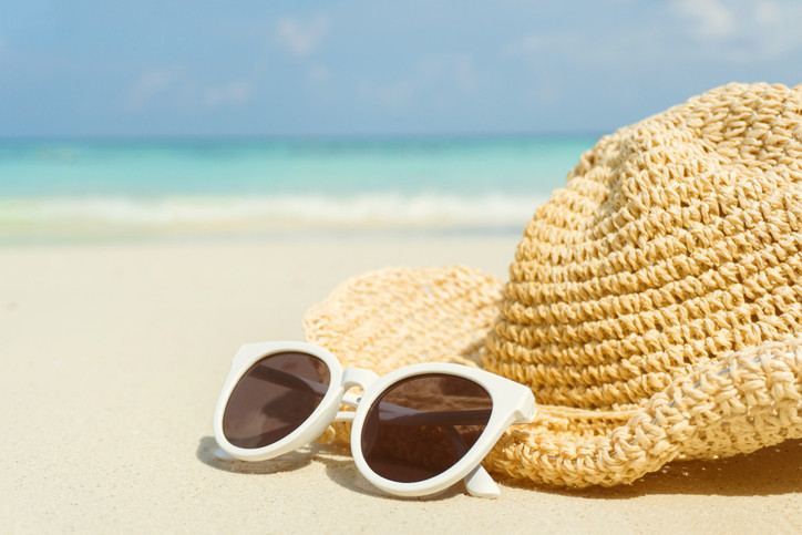 hat-and-sunglasses-on-a-beach