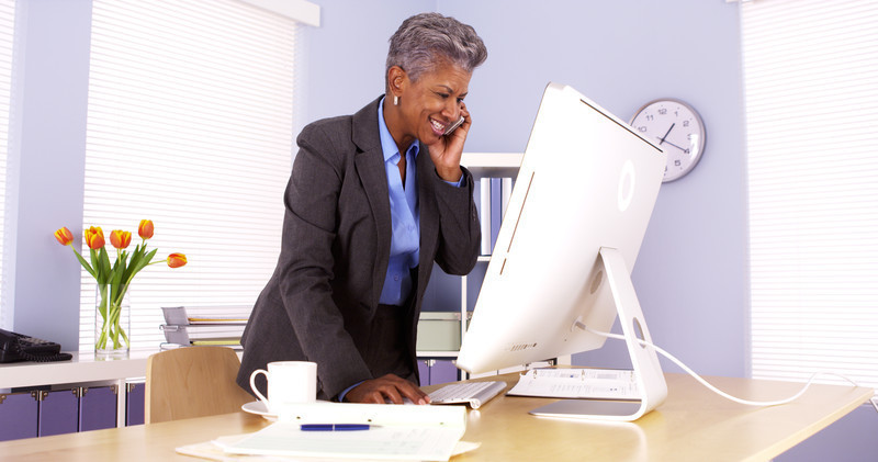 women-standing-at-desk