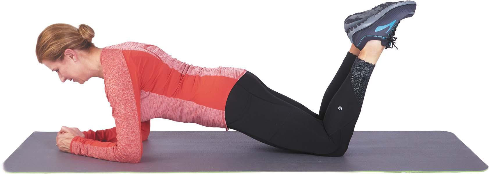 A woman performs the plank exercise, modified with her knees on the floor, as described in the article.