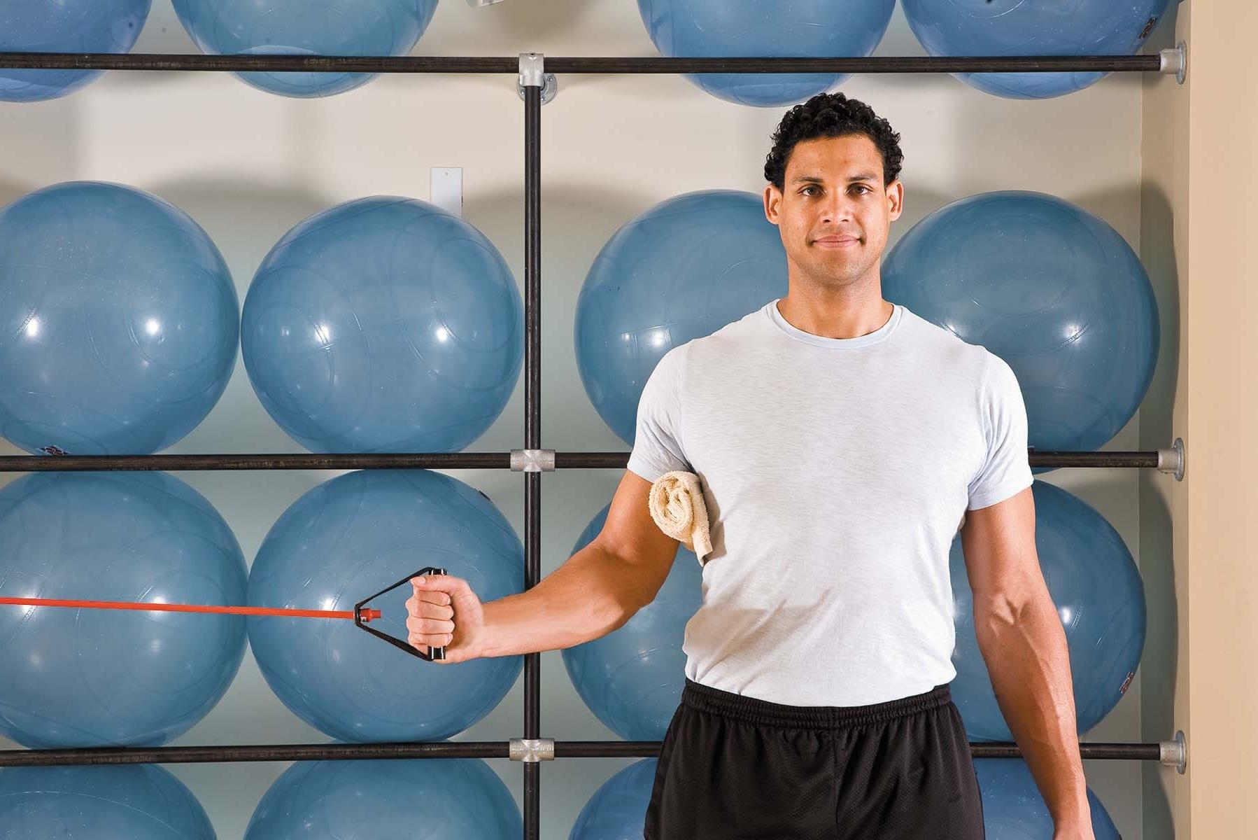 A man shows the starting position for the internal rotation exercise as described in the article.