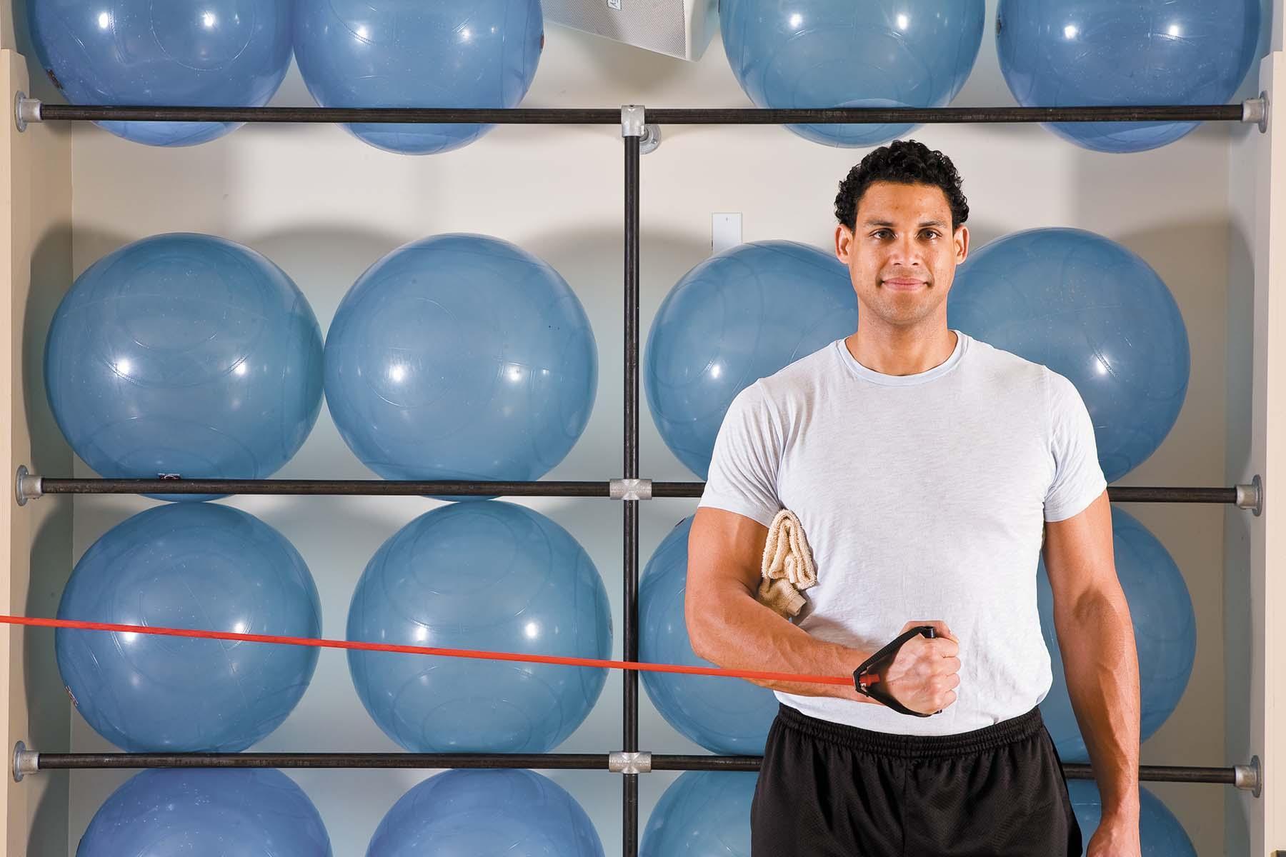 A man shows how to perform the internal rotation exercise as described in the article.