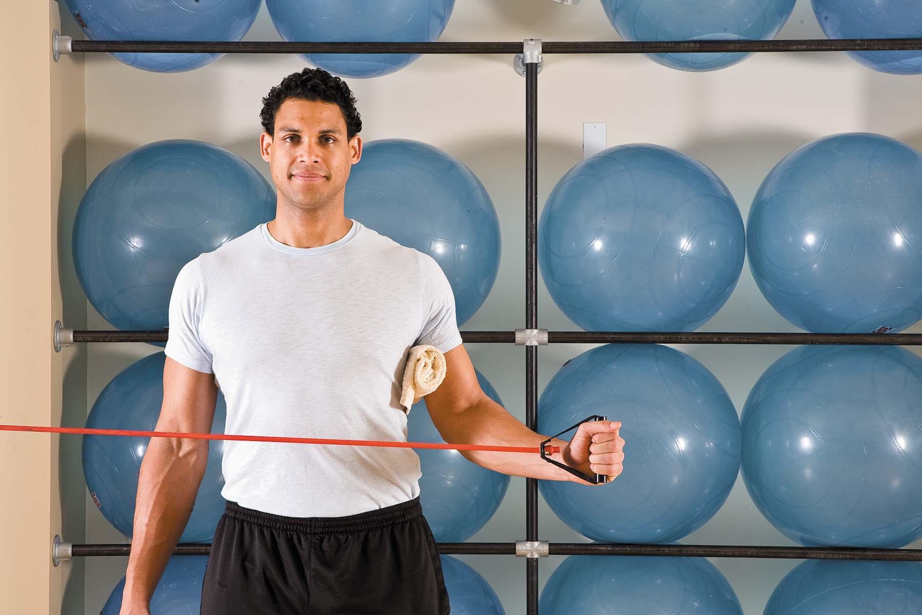 A man shows how to perform the external rotation exercise as described in the article.