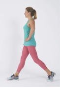 A woman performs the first part of the forward lunge exercise as described in the article.