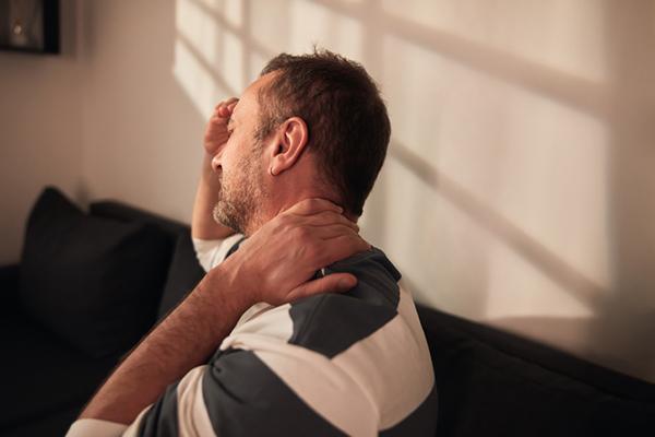 Can a neck artery tear after head or neck trauma lead to a stroke?