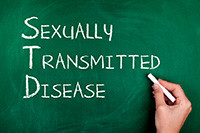 image of words sexually transmitted disease on a blackboard