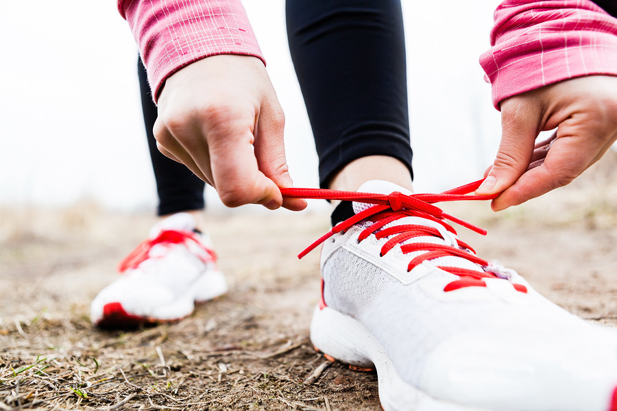 Women-tying-running-shoes