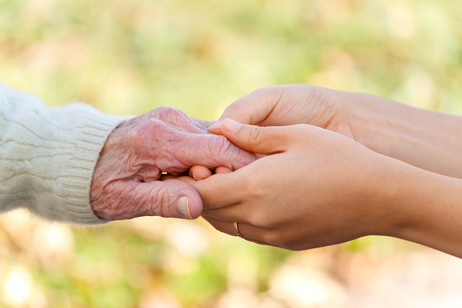 bigstock-Senior-And-Young-Holding-Hands-caregiving