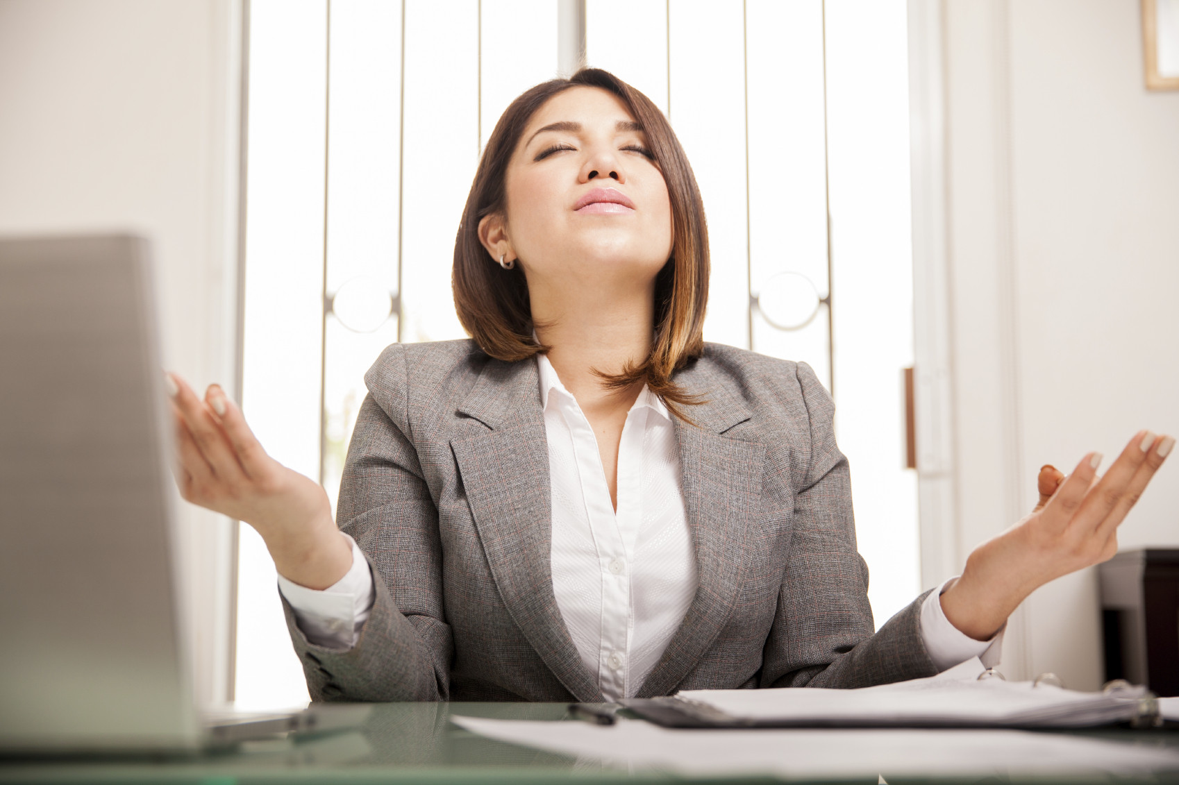 woman-meditating-at-work-mindful-moddiStock_000057640526_Medium