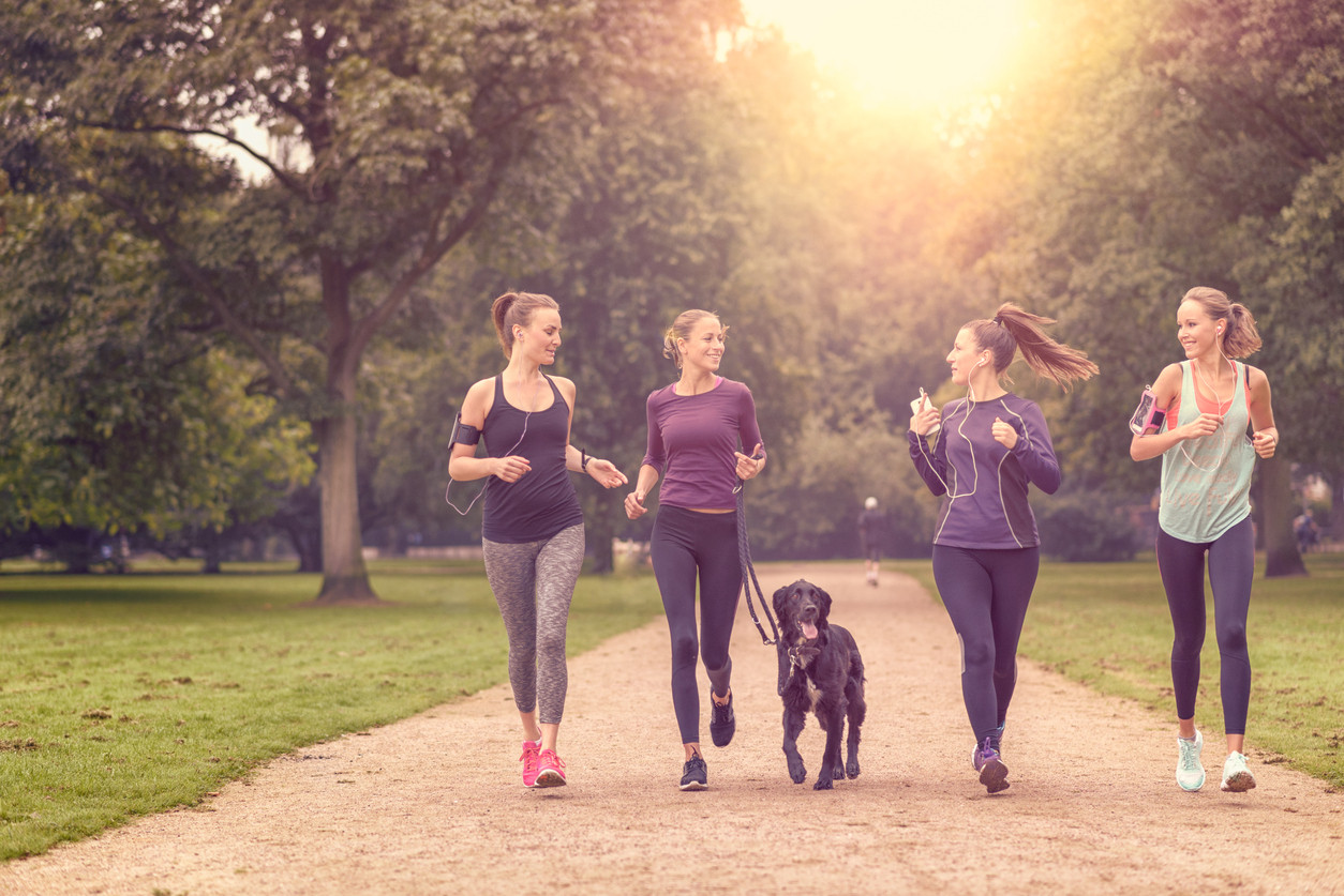 women-running-dog-exercise-cardio-LarsZahnerPhotography-iStock-488120380