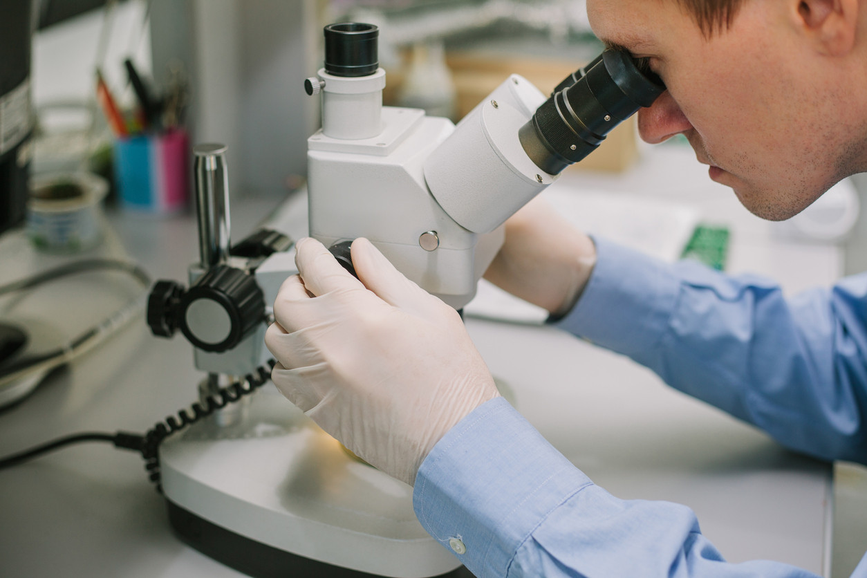 researcher-microscope-percision-medicine-iStock-627326270